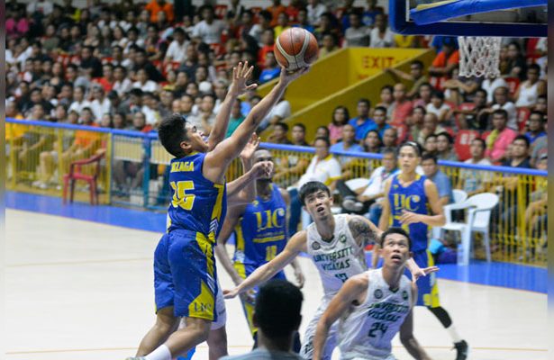Michael Jay Gonzaga (left) scoops it in for UC in Game 1 of the Cesafi finals. (SunStar Photo/Amper Campaña)