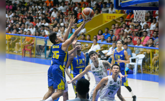 Michael Jay Gonzaga (left) scoops it in for UC in Game 1 of the Cesafi finals. (SunStar Photo/Amper Campaña)
